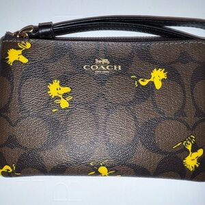 Limited Edition COACH X Peanuts • Woodstock Wristlet • Signature coated canvas
